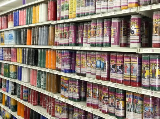 Colorful rows of video tapes arranged on shelves in a store.